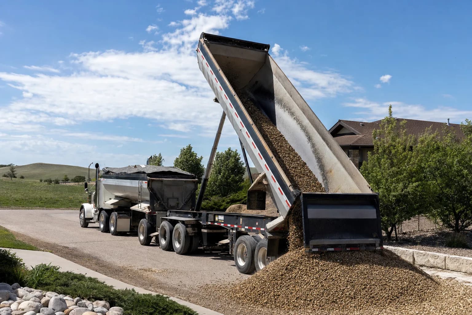 Dump truck delivering gravel
